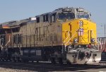 UP 7281 A Very Brand New 2 Month Old C44ACM Remodeled Locomotive Leads A Train Consisting of Brand New Rails Heading to the UP Salt Lake City Yard Utah As The Wyoming Sun Reflects Off Her New UP Paint Scheme Paint.